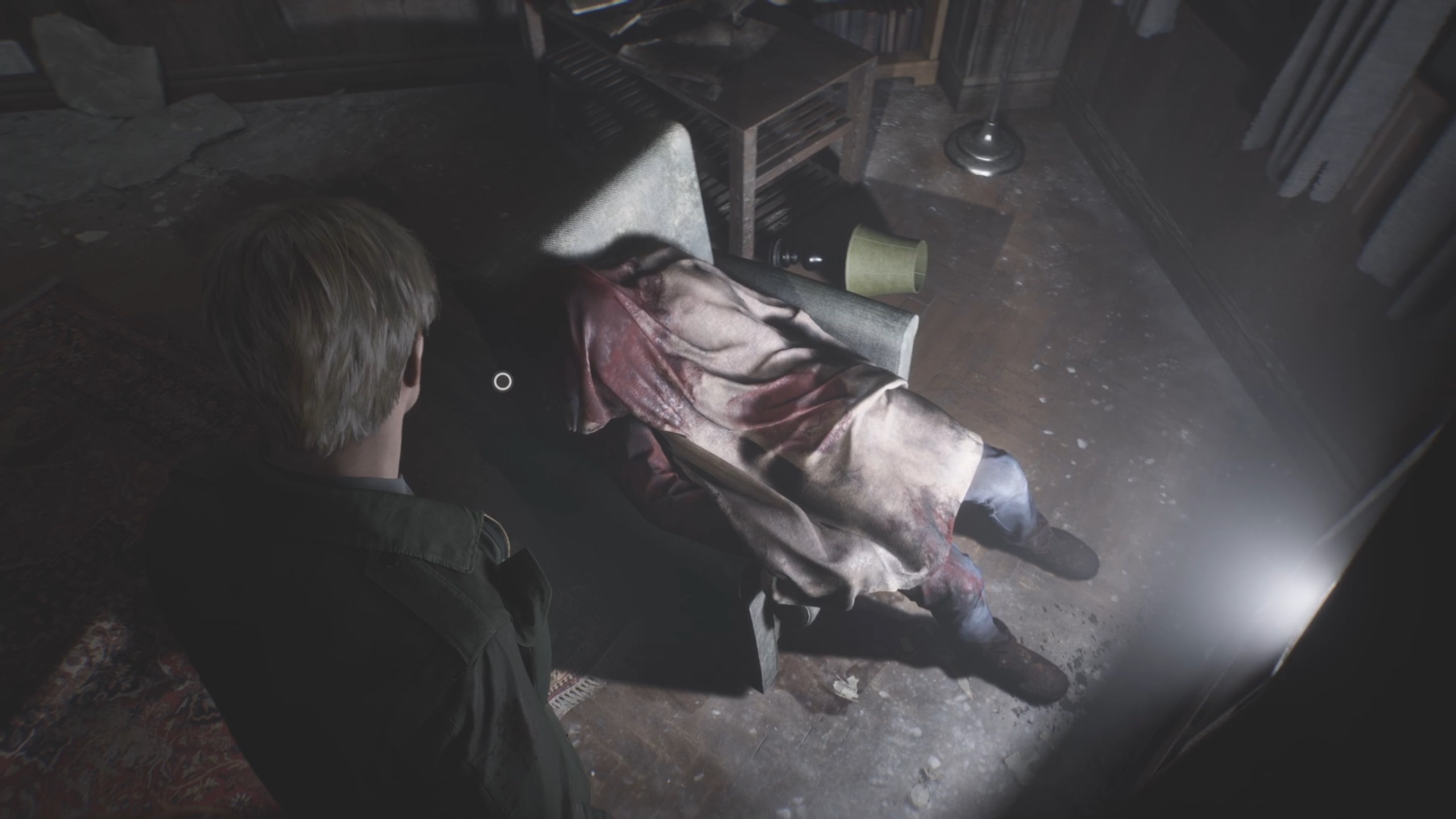 Fans have speculated that this man, who seems to have shot himself, is James since the release of the original game.